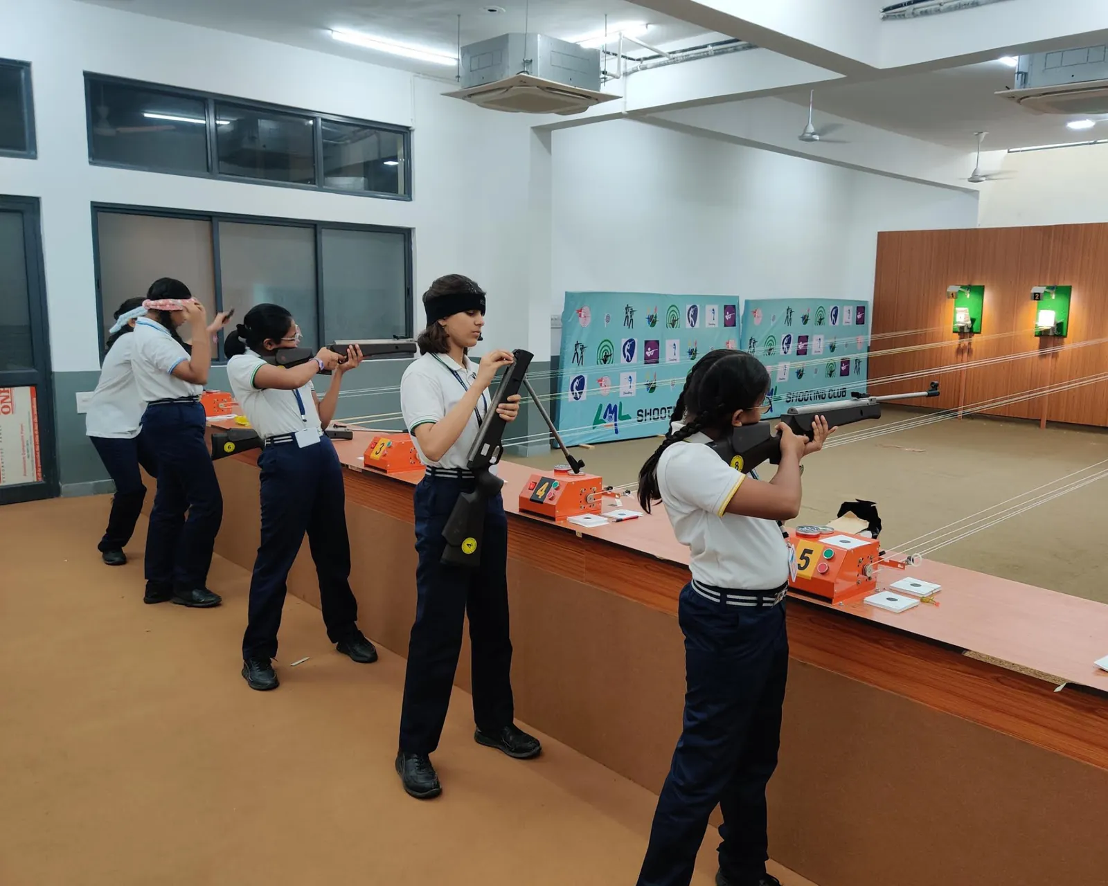 School students training on a 10m air rifle range
